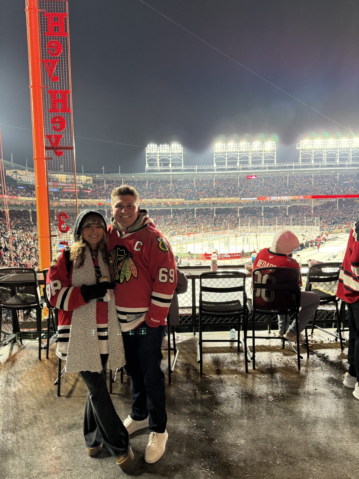 Bundled up in Blackhawks jerseys at the outdoor Winter Classic rink
